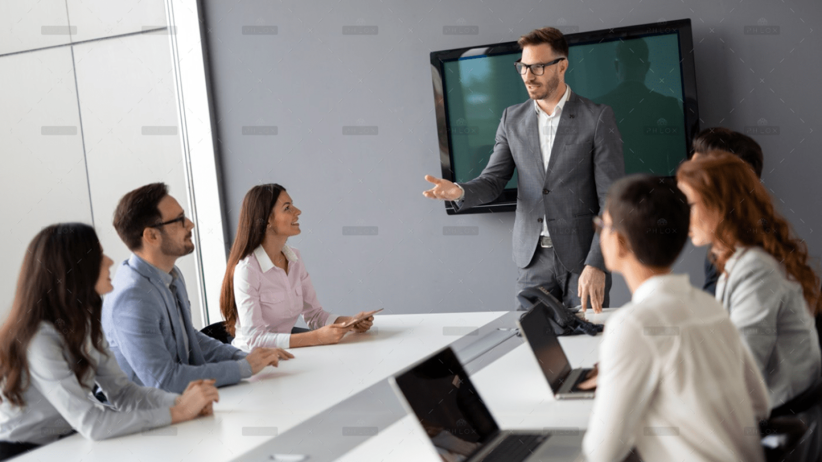 Serene valley with tall grass and a trickling stream under the meridian sun, symbolizing a profound connection to nature and the divine